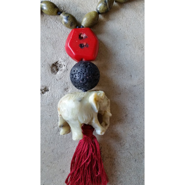 Essential oil diffuser necklace - knotted yellow turquoise, red coral - mala - elephant amulet and tassle