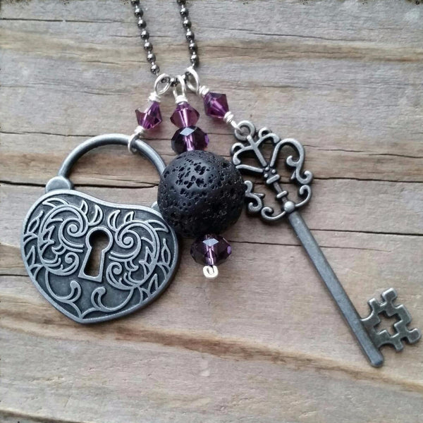 Essential oil diffuser necklace-cluster-skeleton key-heart- lock- Swarovski Crystal- antiqued silver