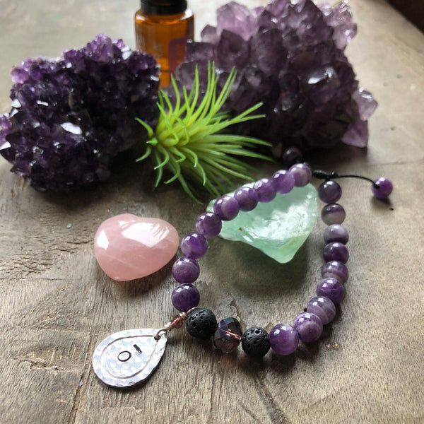 Hand stamped essential oil diffuser bracelet- amethyst with drop charm