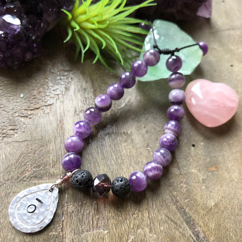 Hand stamped essential oil diffuser bracelet- amethyst with drop charm